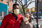 Image of a male and a female each wearing a mask covering the nose and mouth.