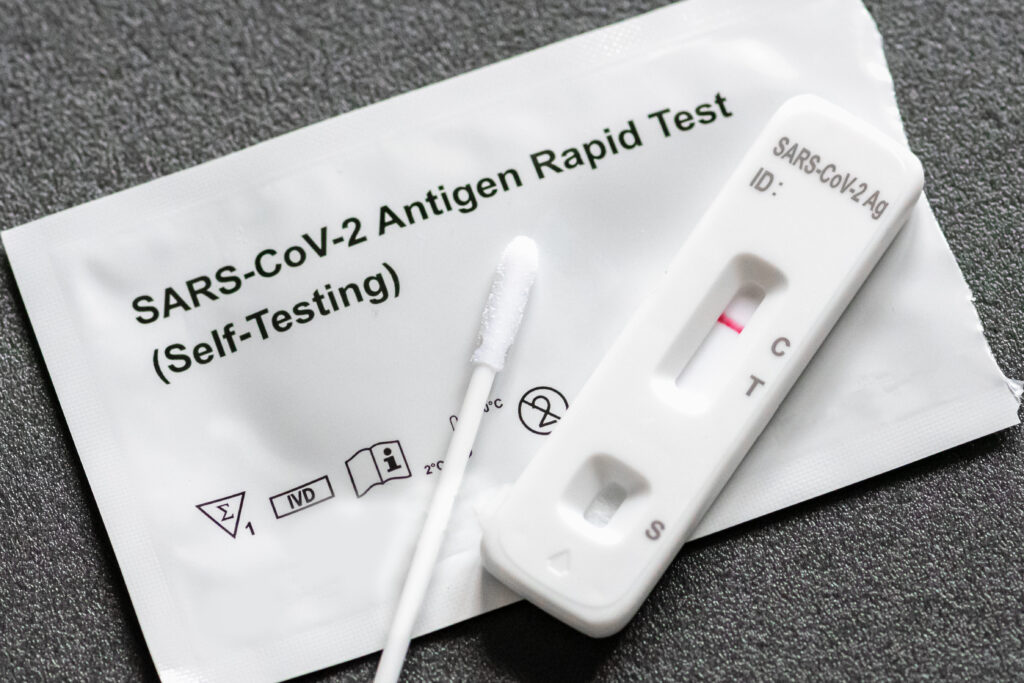 A photo of a COVID-19 at-home test that was used. The red line is on control so it means it's negative.
